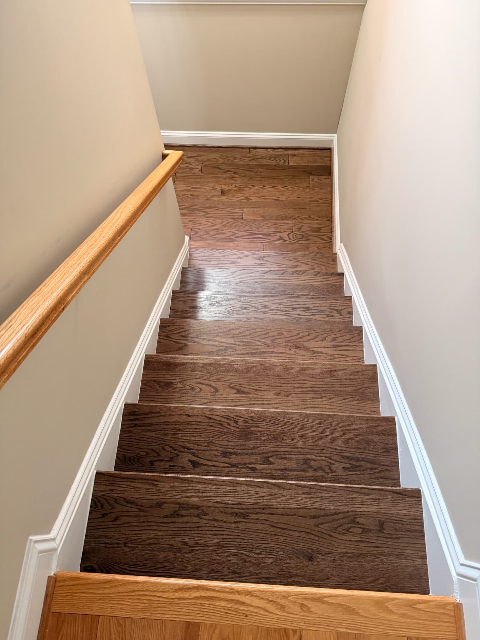 The finished stairs and the landing below them, seen from the top