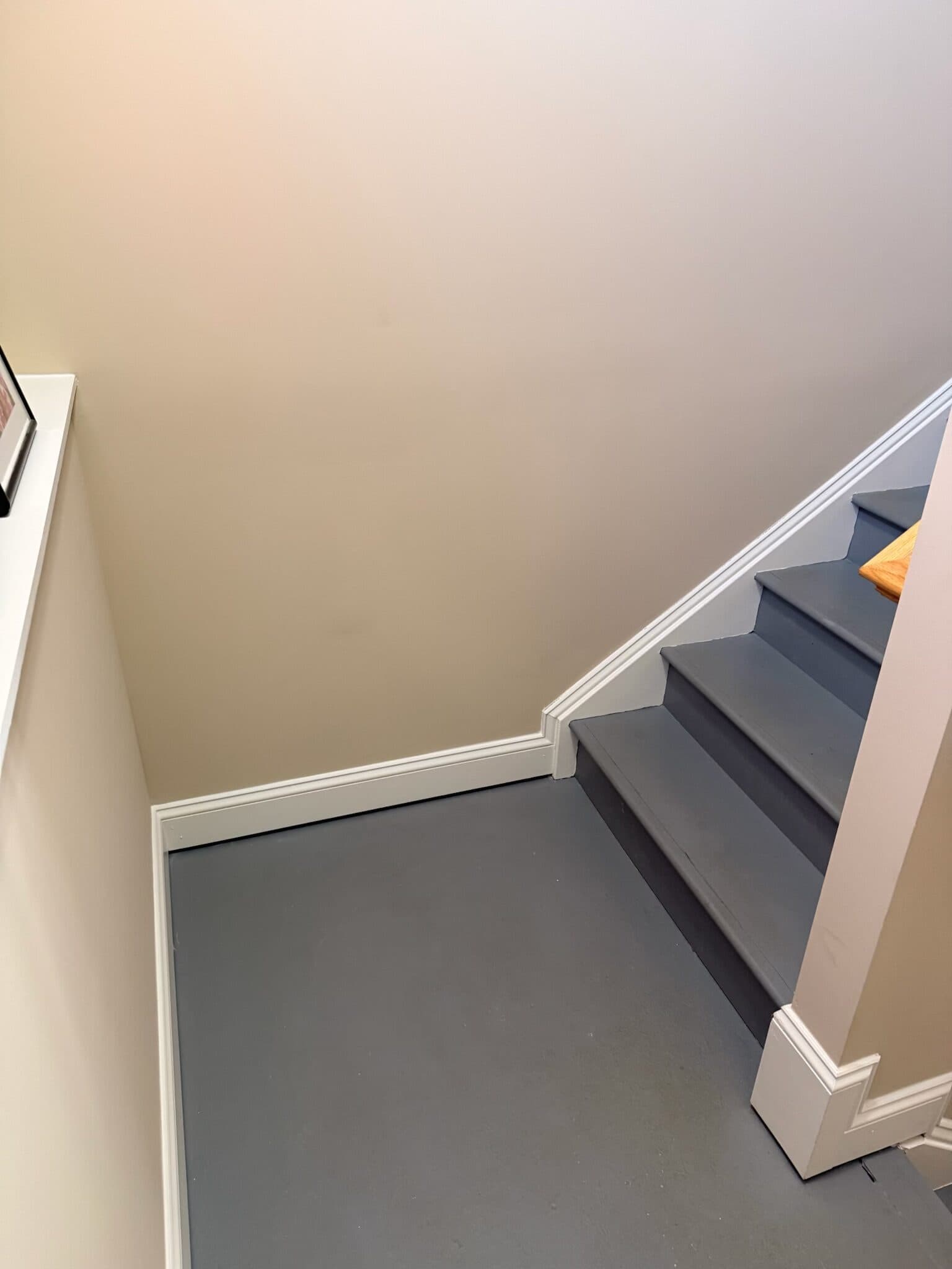 Before: the bottom landing, painted grey right up to the baseboard
